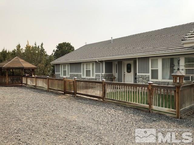 2640 Castle Peak Road Reno, NV 89521 - Photo 2 of 25 a view of a house with a fence