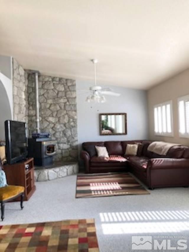 2640 Castle Peak Road Reno, NV 89521 - Photo 6 of 25 a living room with furniture and a flat screen tv