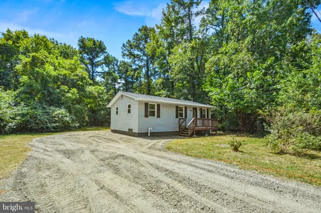 a house with trees in the background