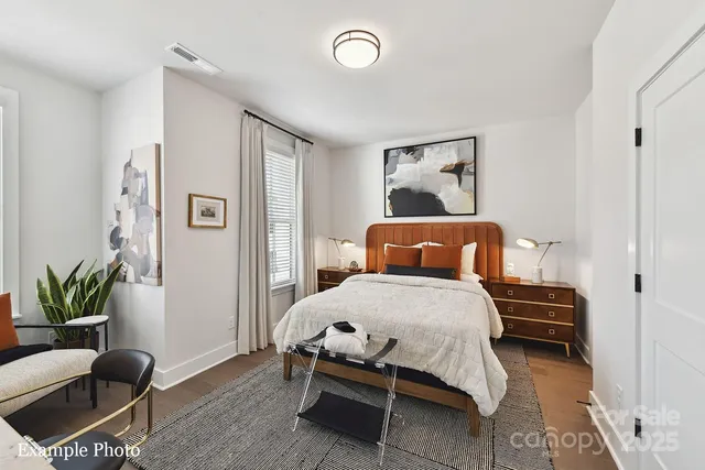 a bedroom with a bed and a couch