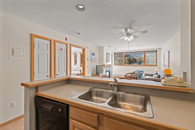 a kitchen with a sink and a window