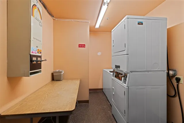 a kitchen with a refrigerator and a stove