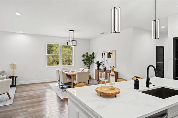 a kitchen with a table and chairs in it
