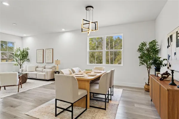 a dining room with furniture window wooden floor
