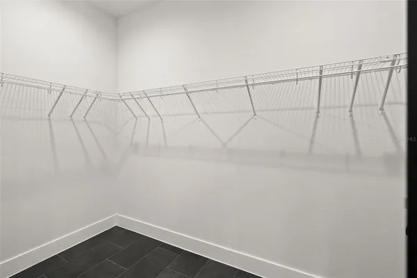 a view of a room with racks on the wall