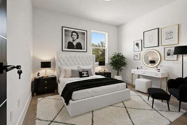 a bedroom with a bed and a chair