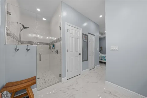a bathroom with a shower and a toilet