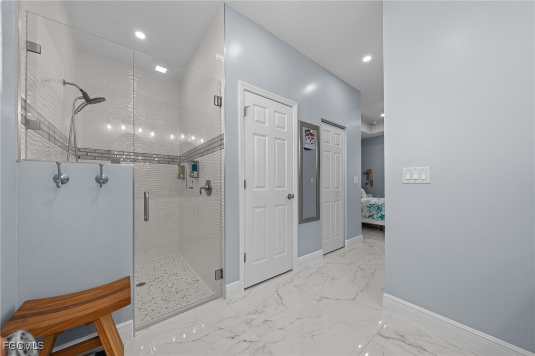 2906 9th Street Southwest Lehigh Acres, FL 33976 - Photo 19 of 30 a bathroom with a shower and a toilet