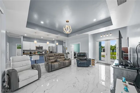 a living room with fireplace furniture and a flat screen tv
