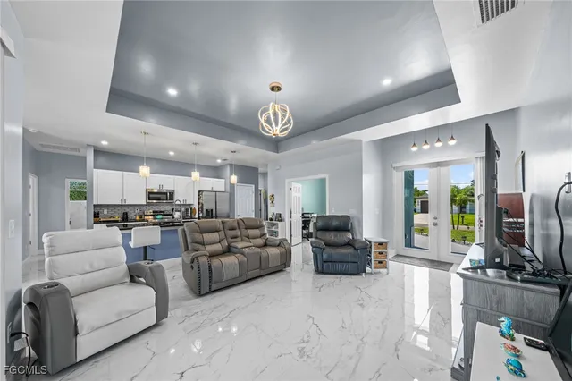 a living room with fireplace furniture and a flat screen tv