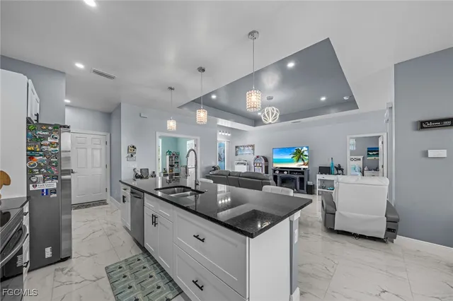a large kitchen with a counter space and furniture