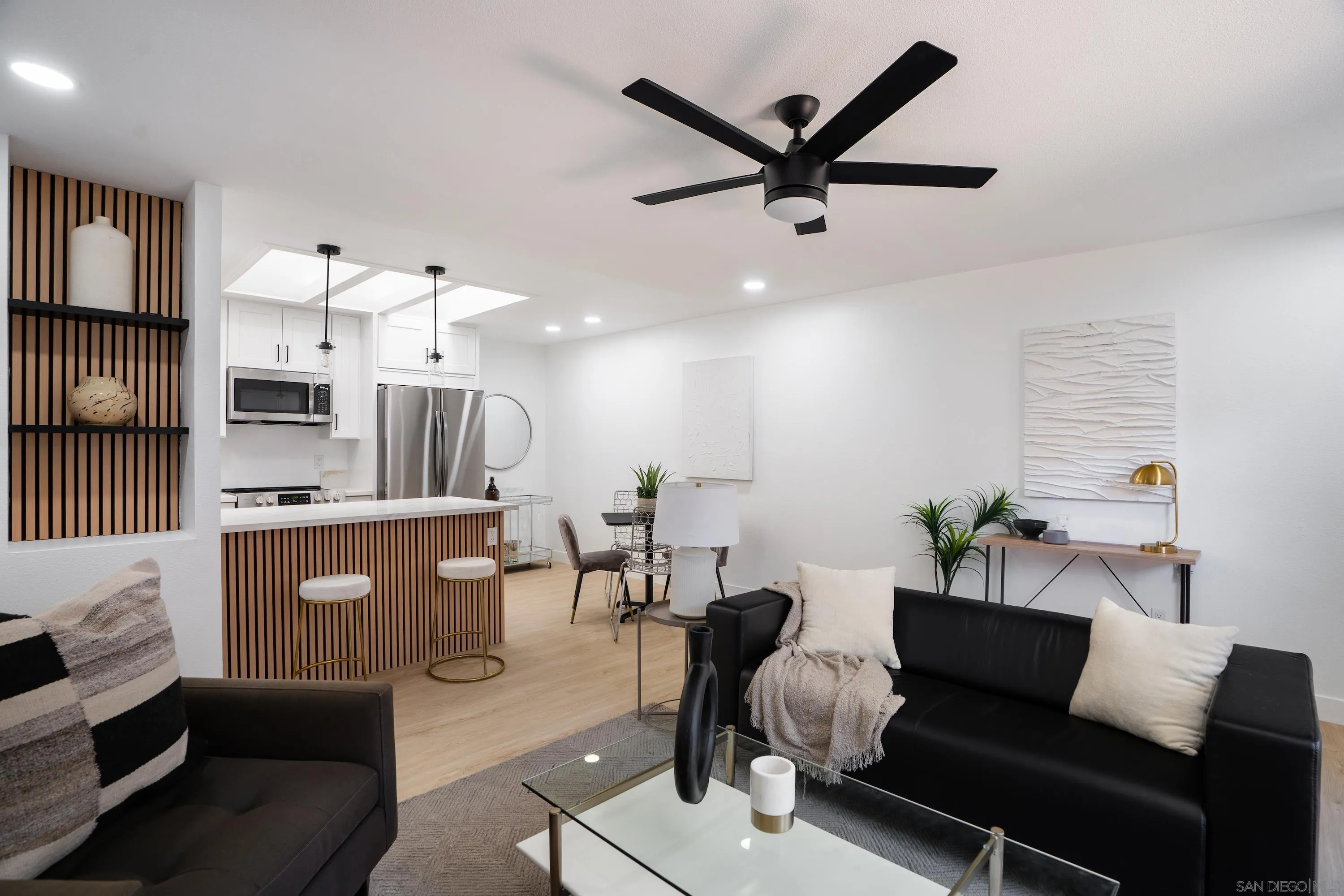 6376 Rancho Mission Road, Unit 402 San Diego, CA 92108 - Photo 1 of 27 a living room with furniture and kitchen view
