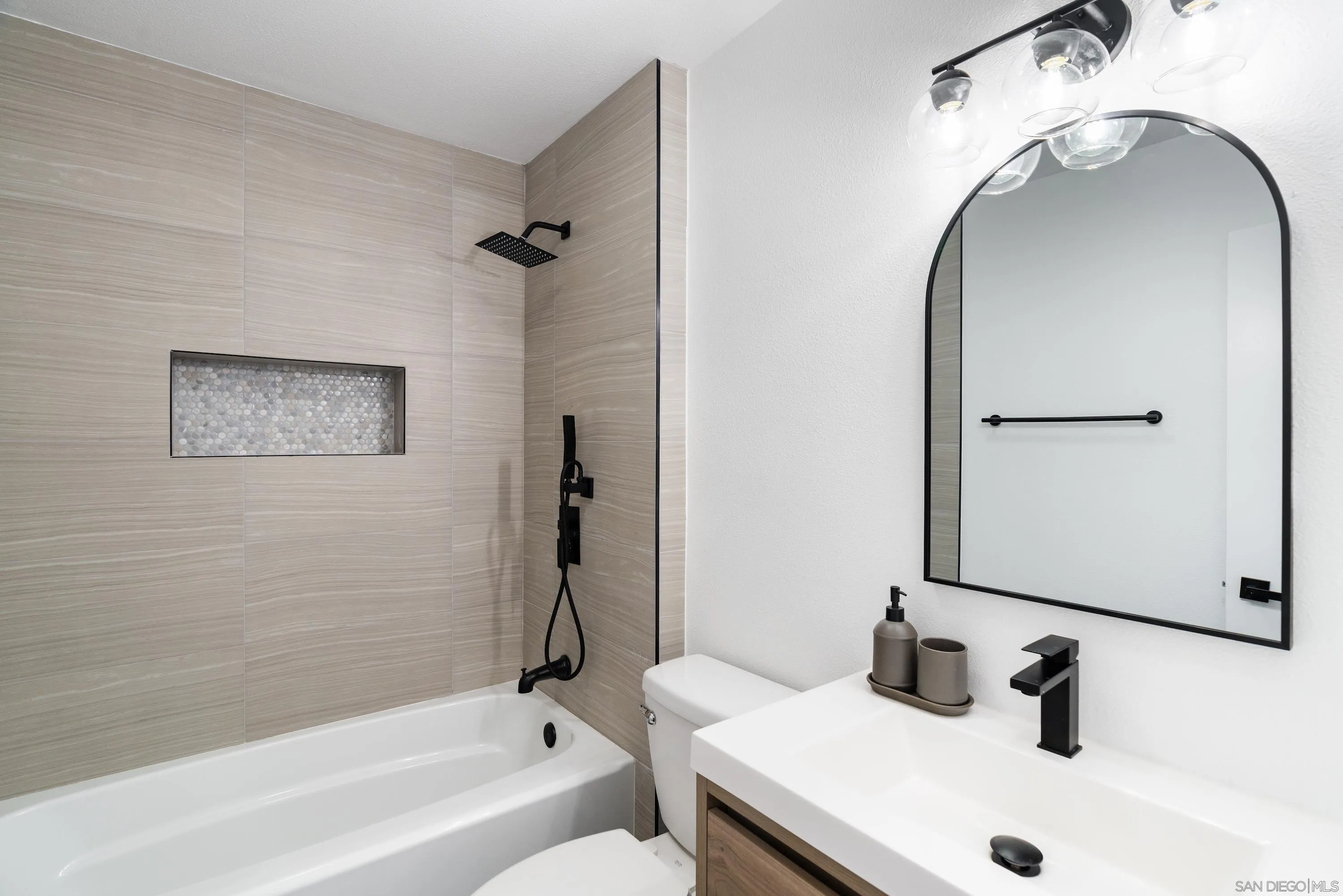 6376 Rancho Mission Road, Unit 402 San Diego, CA 92108 - Photo 16 of 27 a bathroom with a sink and a mirror