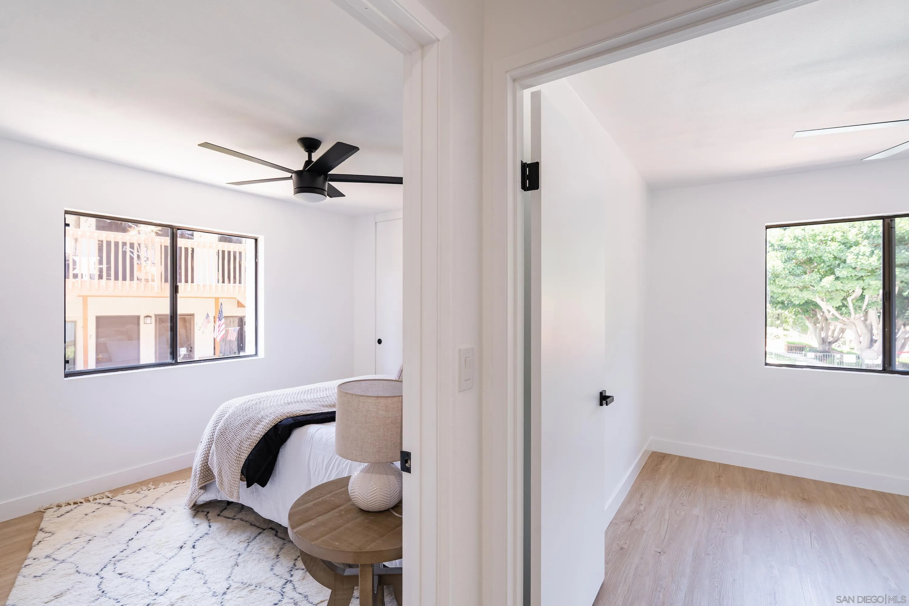 6376 Rancho Mission Road, Unit 402 San Diego, CA 92108 - Photo 18 of 27 a bedroom with a bed and a window