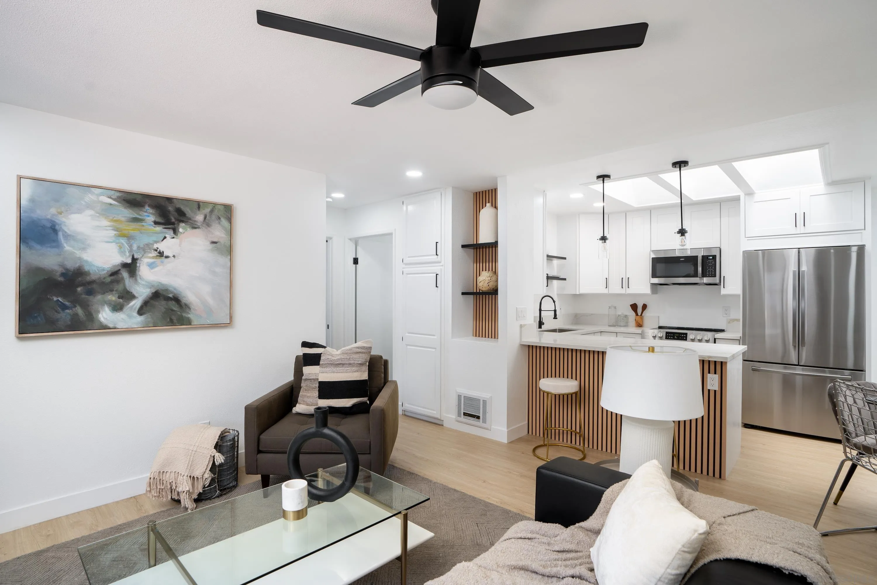 6376 Rancho Mission Road, Unit 402 San Diego, CA 92108 - Photo 2 of 27 a living room with furniture and a kitchen view