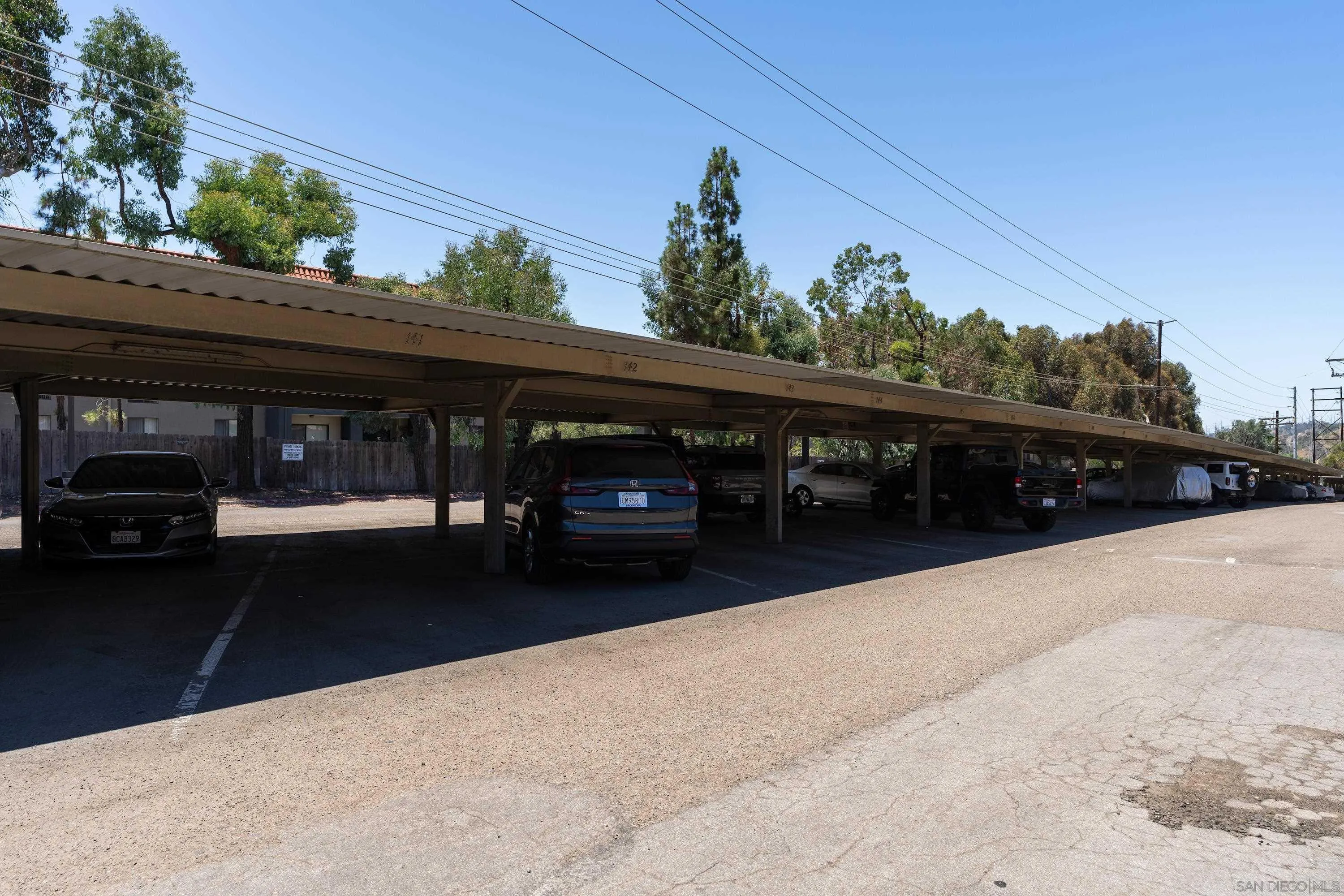6376 Rancho Mission Road, Unit 402 San Diego, CA 92108 - Photo 26 of 27 a view of house with car parked