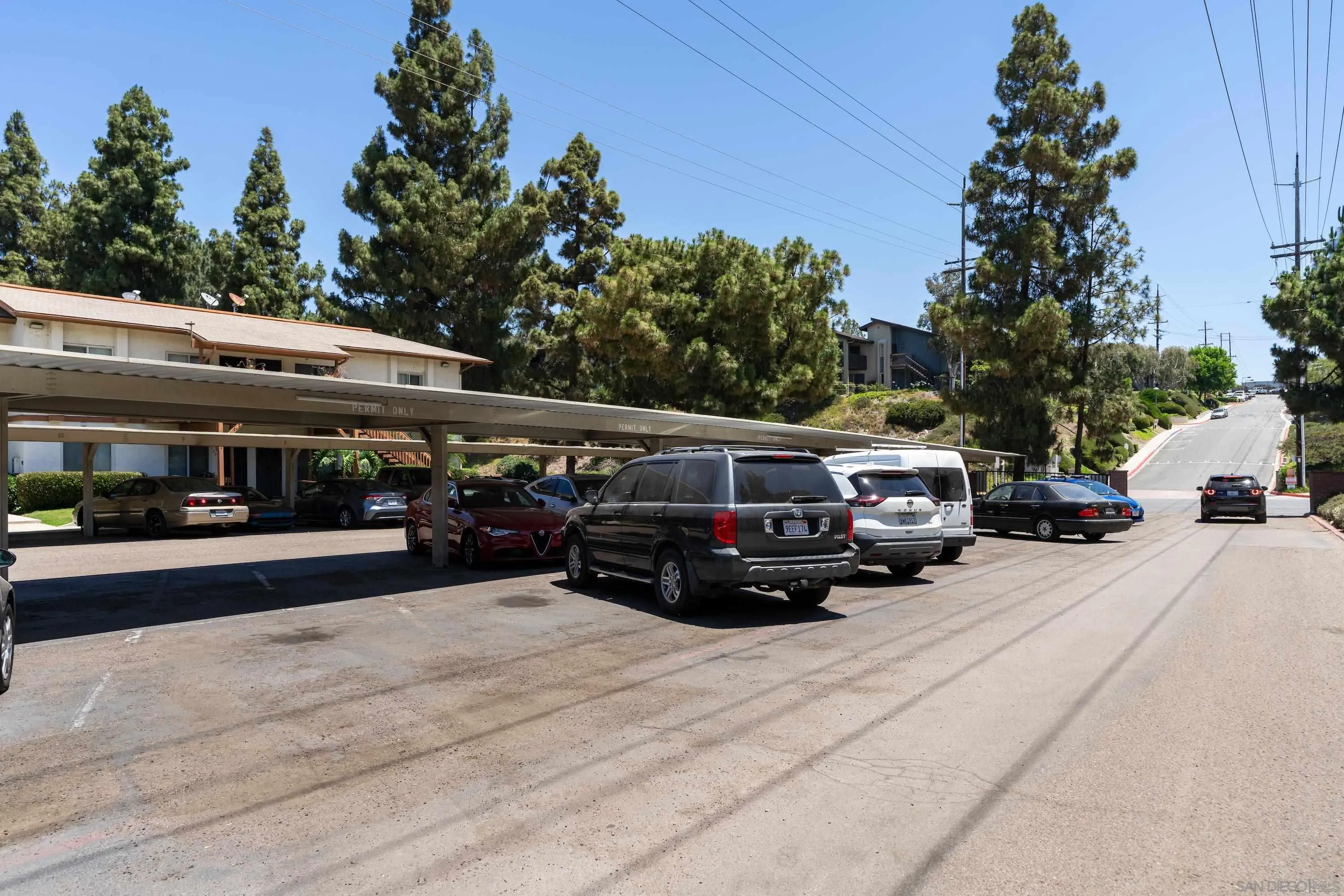 6376 Rancho Mission Road, Unit 402 San Diego, CA 92108 - Photo 27 of 27 a car parked in front of a building