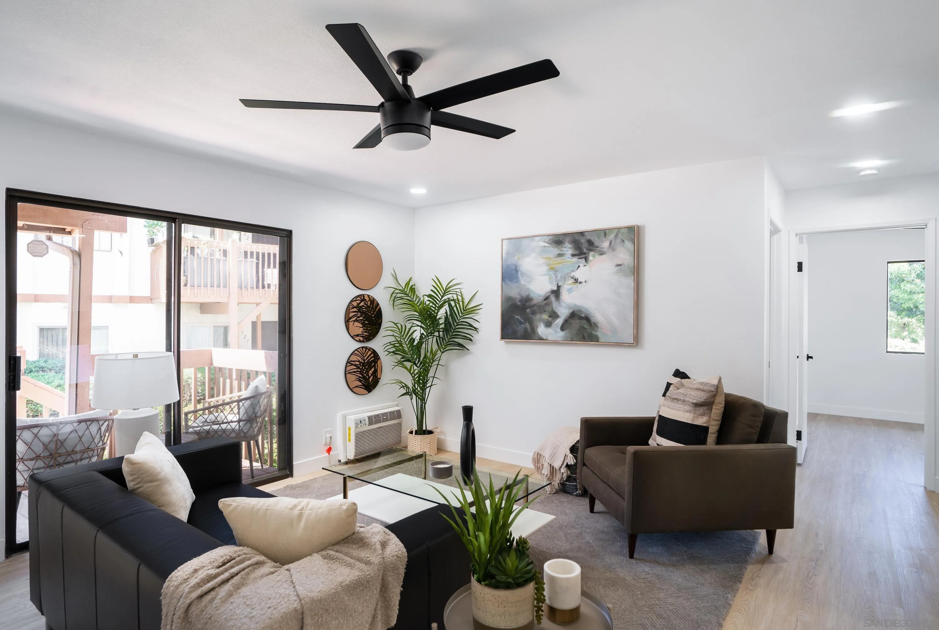 6376 Rancho Mission Road, Unit 402 San Diego, CA 92108 - Photo 3 of 27 a living room with furniture and a large window