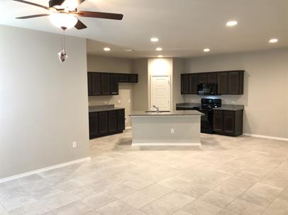 1727 Davidson Ranch Road Georgetown, TX 78626 - Photo 4 of 10 Kitchen featuring recessed lighting, baseboards, stove, and black microwave