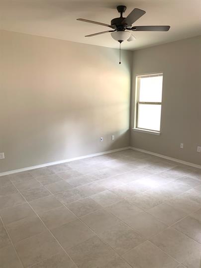 1727 Davidson Ranch Road Georgetown, TX 78626 - Photo 6 of 10 Unfurnished room featuring baseboards and ceiling fan
