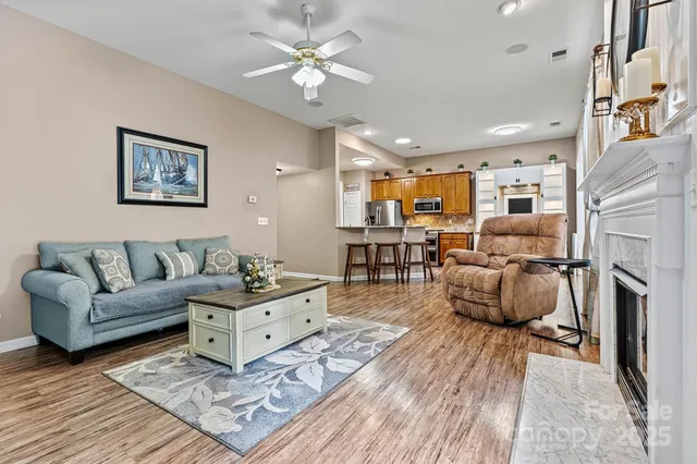 a bedroom with a bed and a flat tv screen on dresser