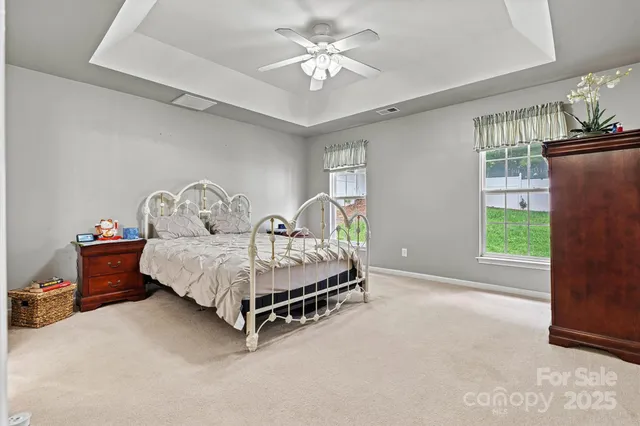 a bathroom with a sink a mirror a toilet and a mirror