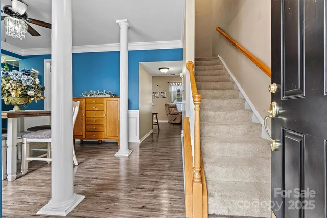 a dining room with furniture and wooden floor