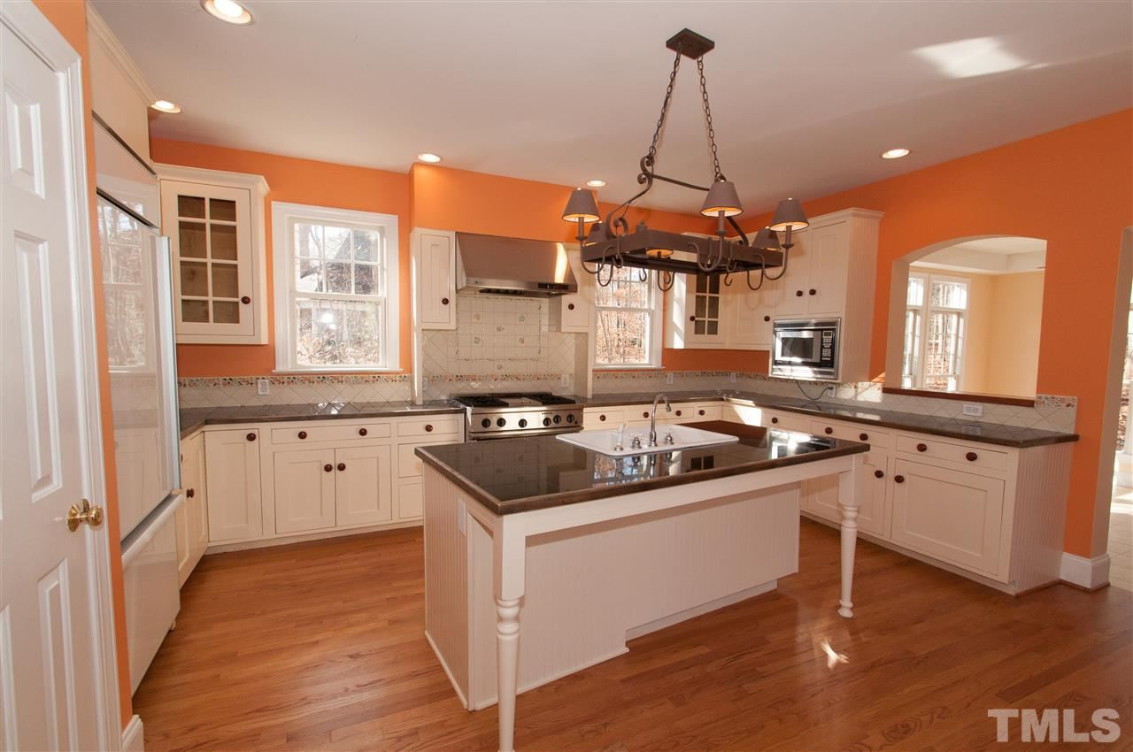 Large island/bar, granite counter top, fabulous stainless steel gas stove with grill, plenty of cabinets and a walk in pantry Kitchen
