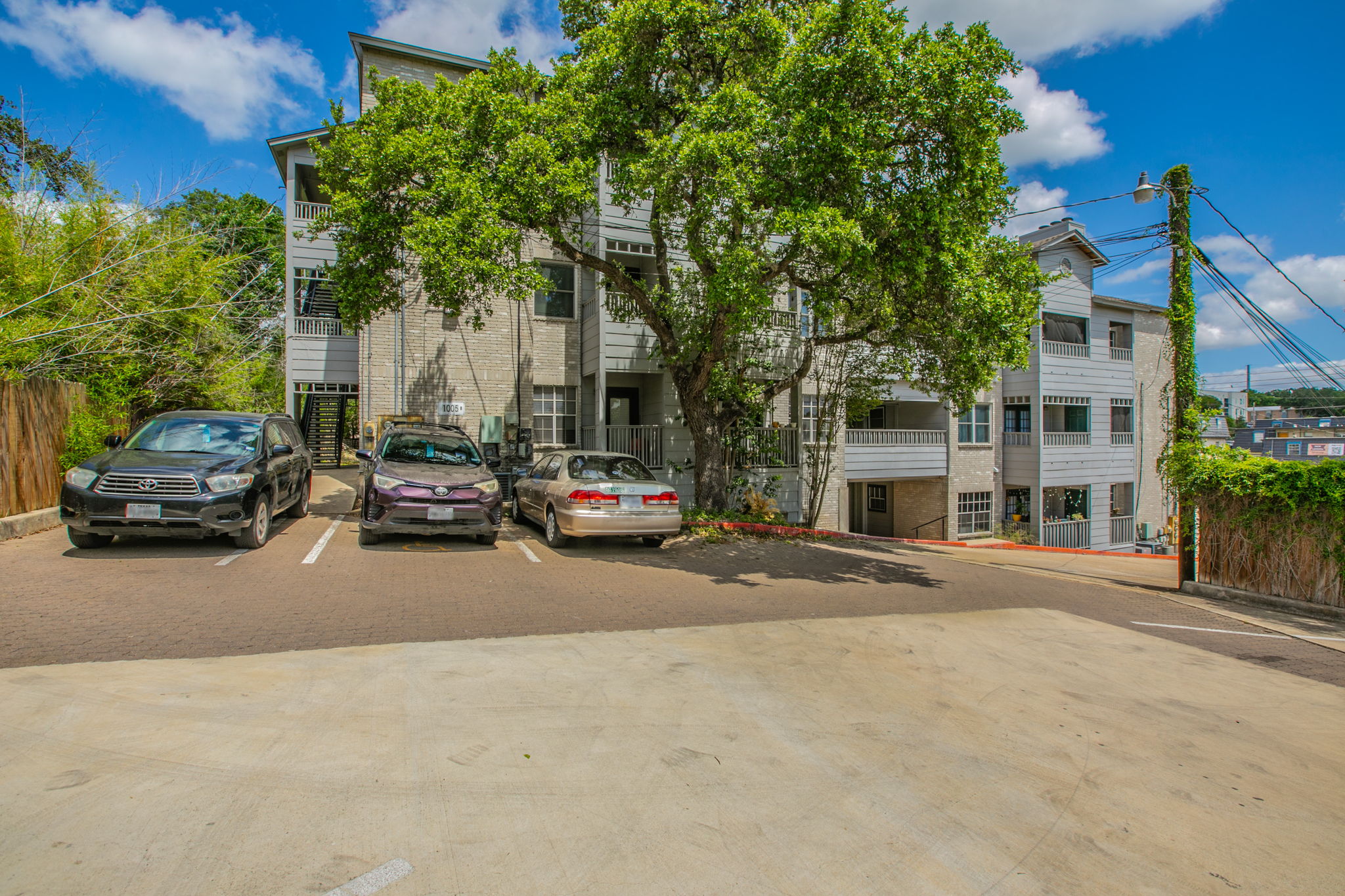 1005 North LBJ Drive, Unit B2 San Marcos, TX 78666 - Photo 18 of 19 a building with trees in front of it