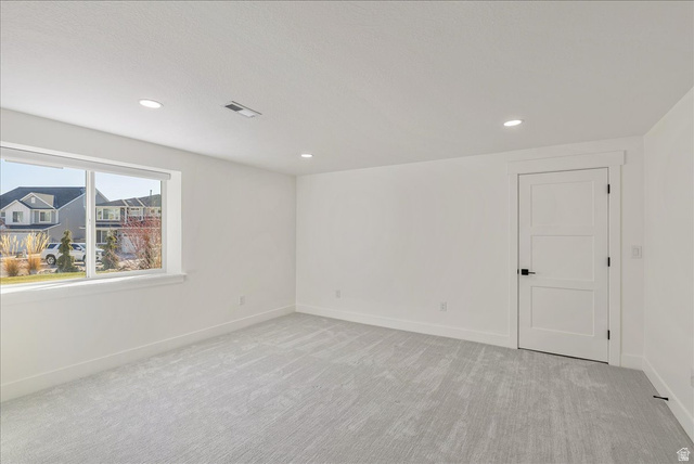882 Spring Dew Lane Lehi, UT 84048 - Photo 45 of 46 Unfurnished room featuring light colored carpet and recessed lighting