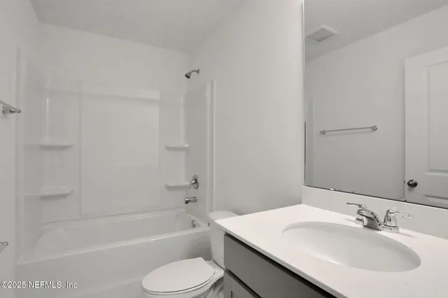 a bathroom with a sink toilet and bathtub