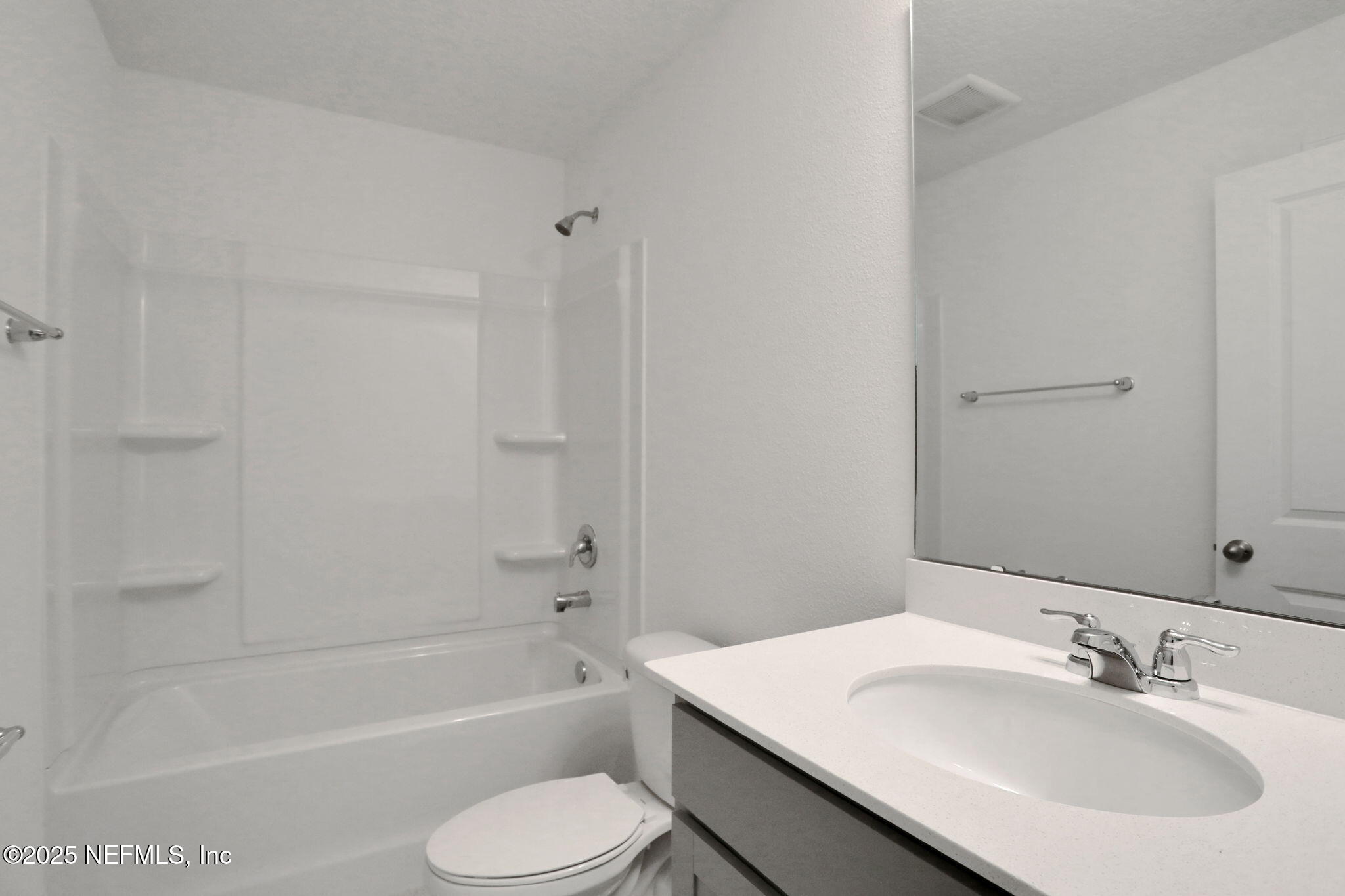 3769 Athenian Way Middleburg, FL 32068 - Photo 13 of 31 a bathroom with a sink toilet and bathtub