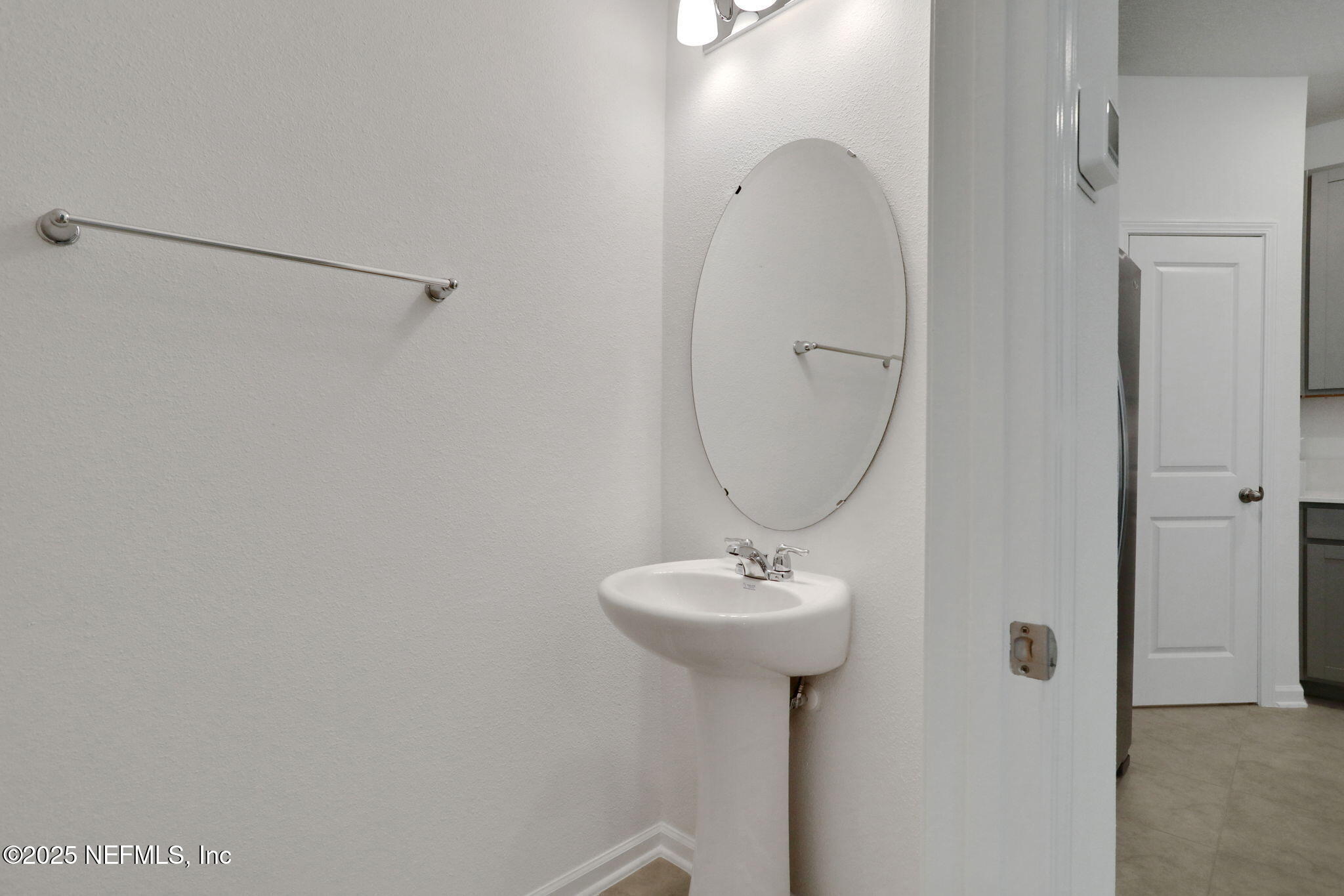 3769 Athenian Way Middleburg, FL 32068 - Photo 26 of 31 a bathroom with a sink toilet and mirror