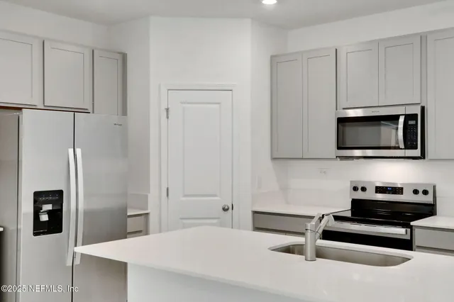 a bedroom with a bed and a television