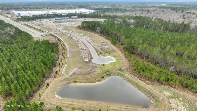 a view of a swimming pool with a yard
