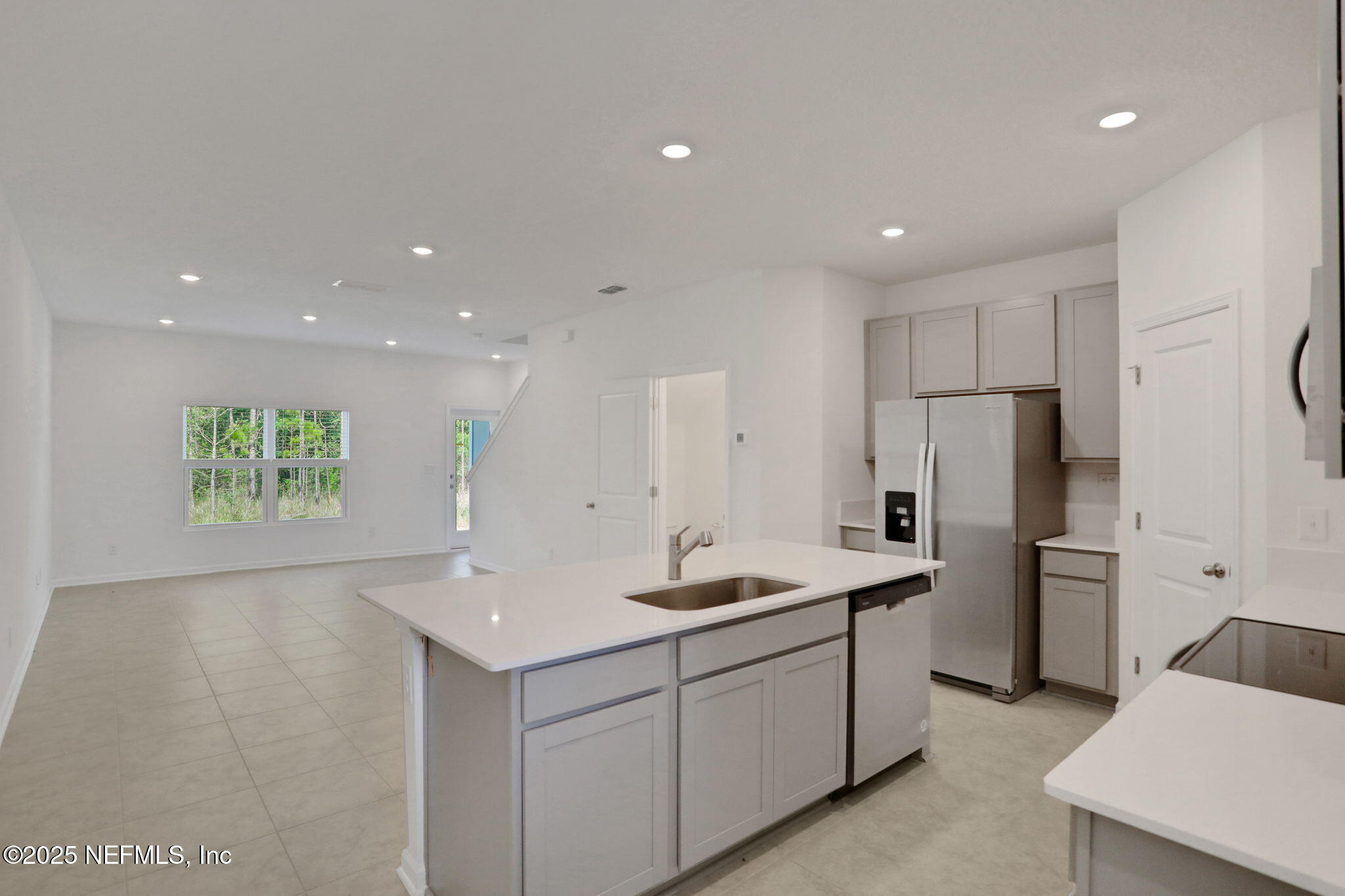 3769 Athenian Way Middleburg, FL 32068 - Photo 8 of 31 a kitchen with refrigerator and cabinets