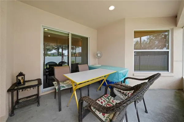a dining room with furniture and window