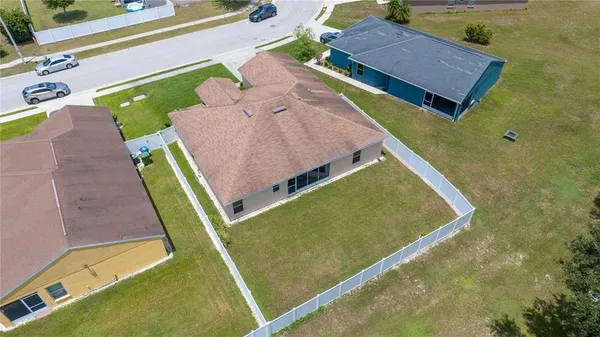 an aerial view of a house with a swimming pool