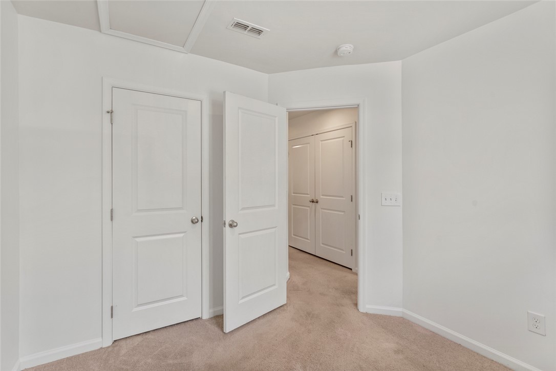 137 Nicklaus Drive Anderson, SC 29621 - Photo 27 of 37 Well-lit room with ample closet space and plush carpeting.