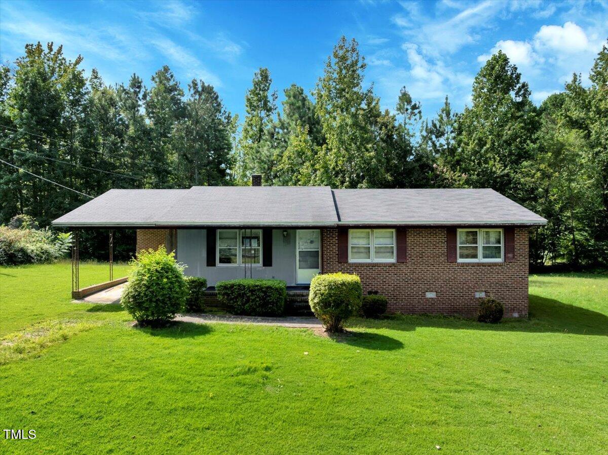 281 Michael's Quarry Road Norlina, NC 27563 - Photo 1 of 12 a front view of a house with garden