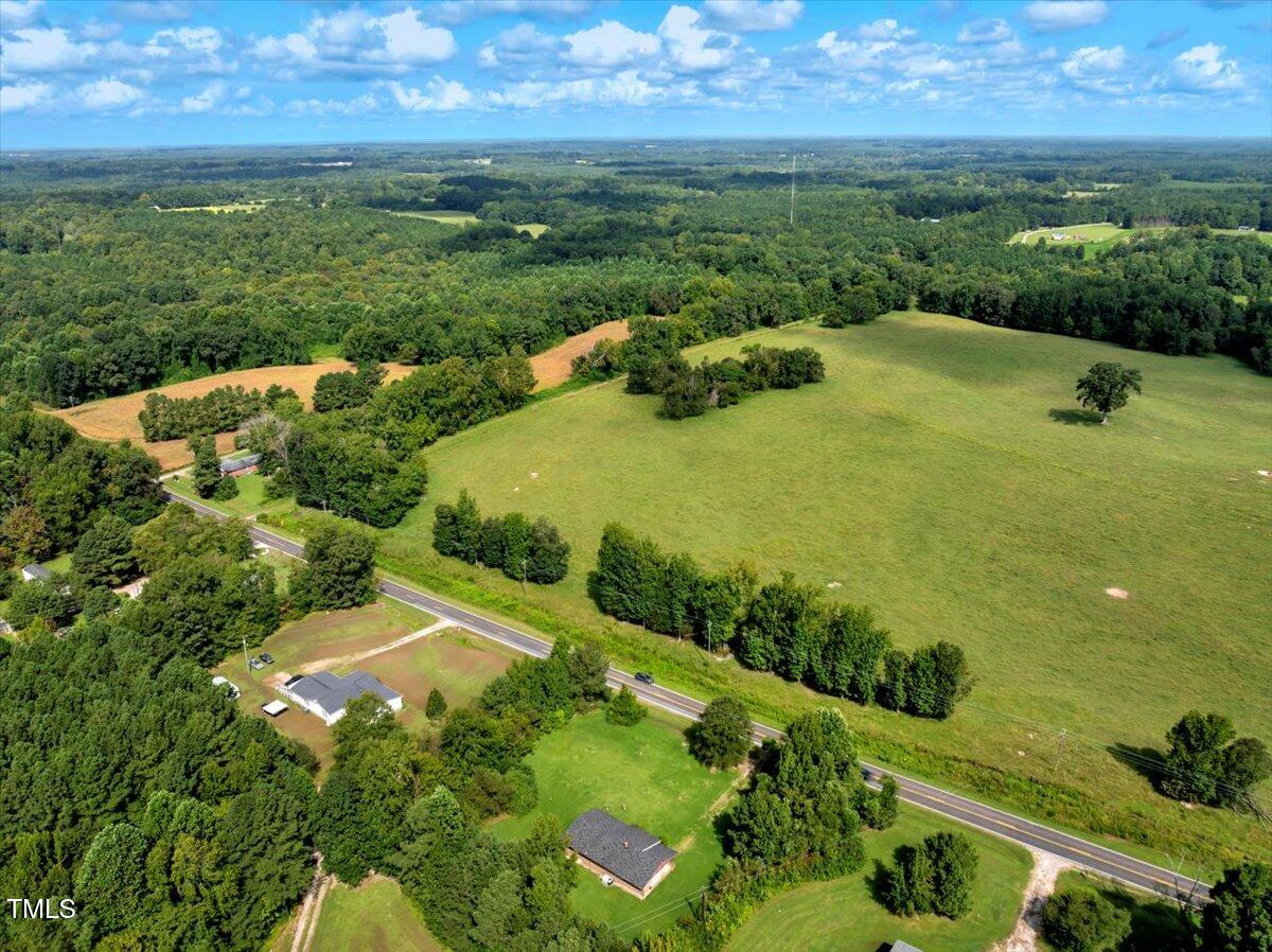 281 Michael's Quarry Road Norlina, NC 27563 - Photo 11 of 12 a view of a golf course with a lake
