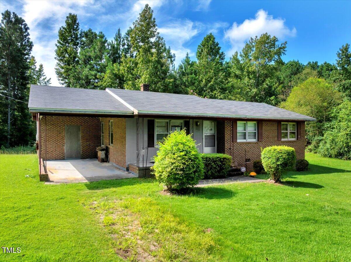 281 Michael's Quarry Road Norlina, NC 27563 - Photo 3 of 12 a front view of a house with garden