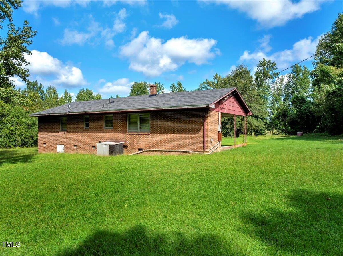 281 Michael's Quarry Road Norlina, NC 27563 - Photo 6 of 12 a front view of a house with yard