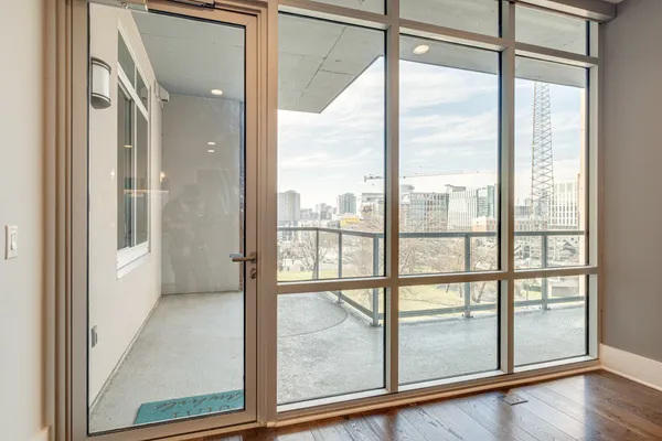 a bathroom with a sink double vanity granite tub shower and a mirror