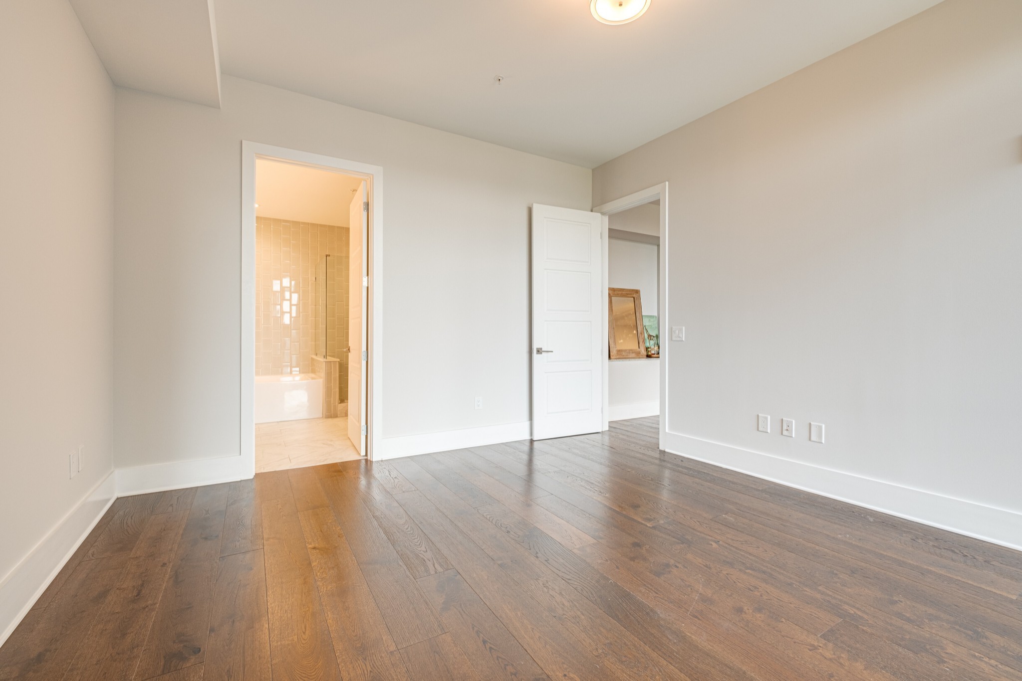 20 Rutledge Street, Unit 406 Nashville, TN 37210 - Photo 23 of 75 a view of an empty room with wooden floor