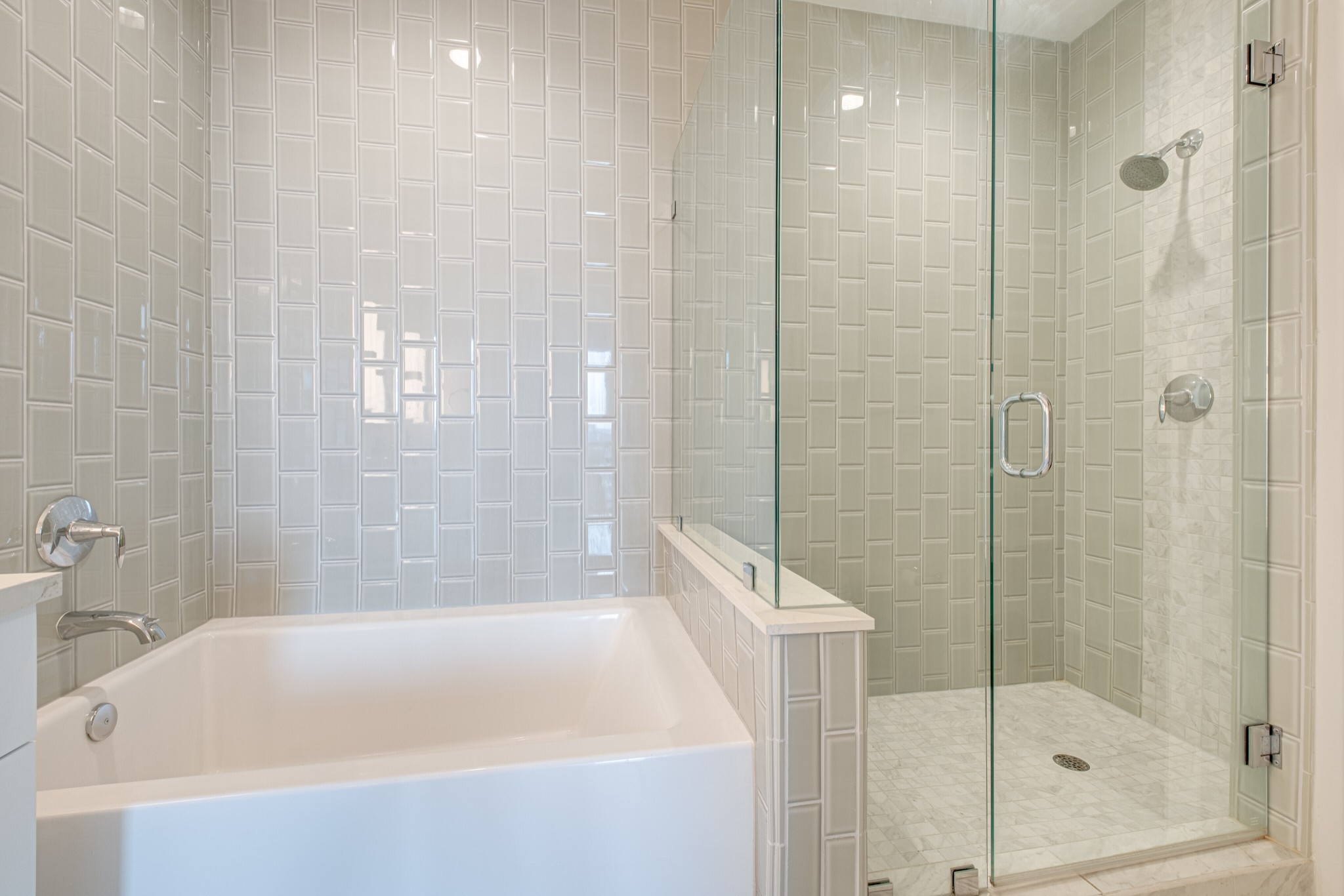 20 Rutledge Street, Unit 406 Nashville, TN 37210 - Photo 25 of 75 a bathroom with a bathtub and shower
