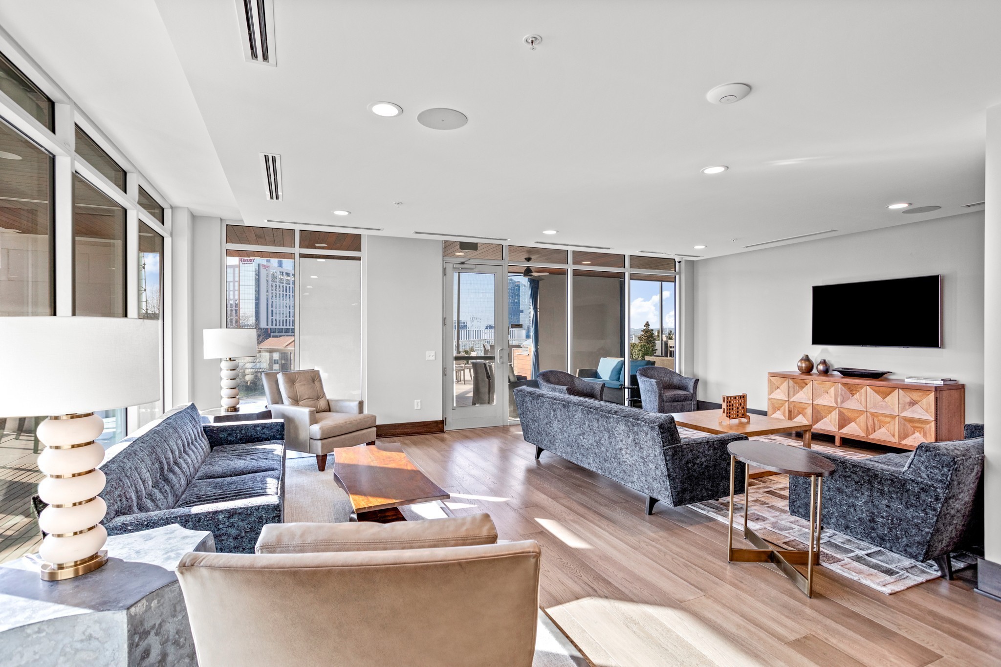 20 Rutledge Street, Unit 406 Nashville, TN 37210 - Photo 44 of 75 a living room with furniture and a flat screen tv