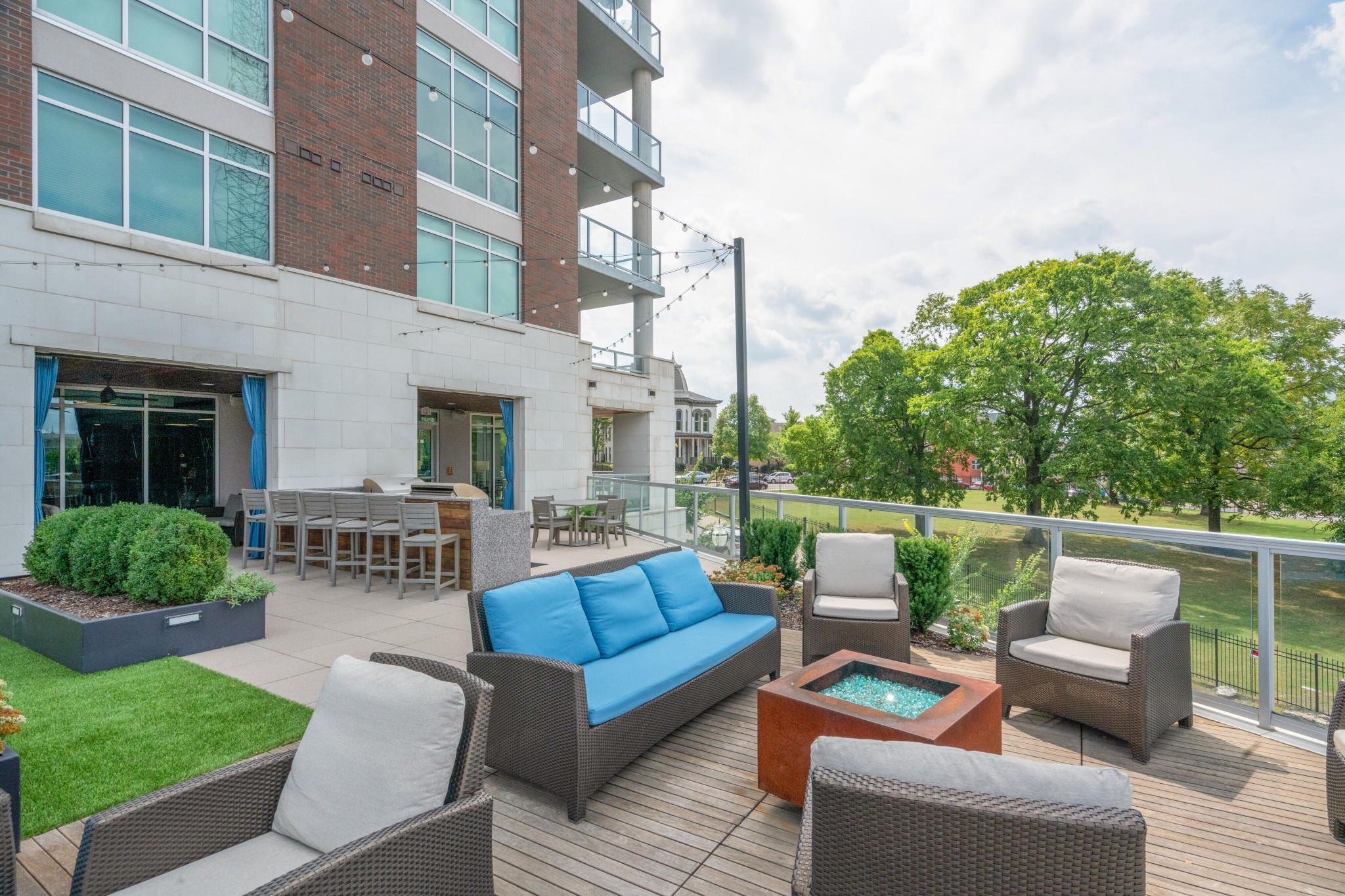 20 Rutledge Street, Unit 406 Nashville, TN 37210 - Photo 49 of 75 a view of a patio with couches chairs and a fire pit
