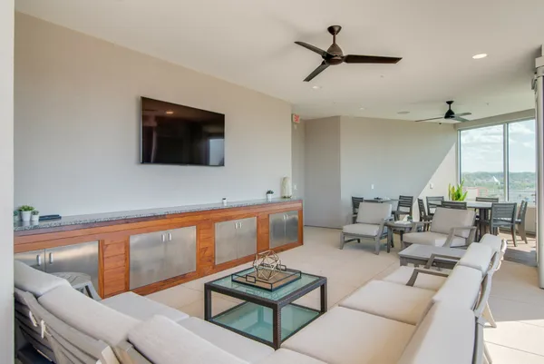 a view of a kitchen with swimming pool and sitting area