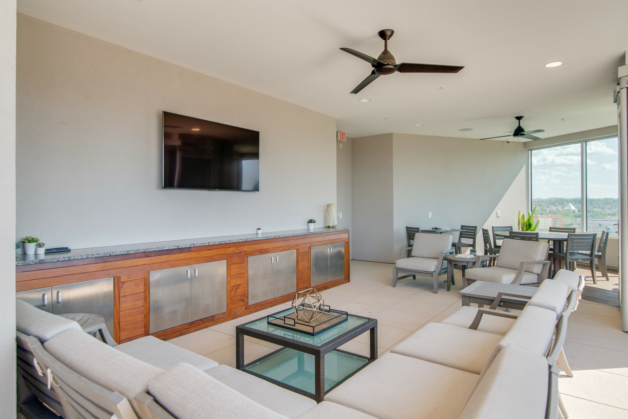 20 Rutledge Street, Unit 406 Nashville, TN 37210 - Photo 50 of 75 a living room with furniture a flat screen tv and a window